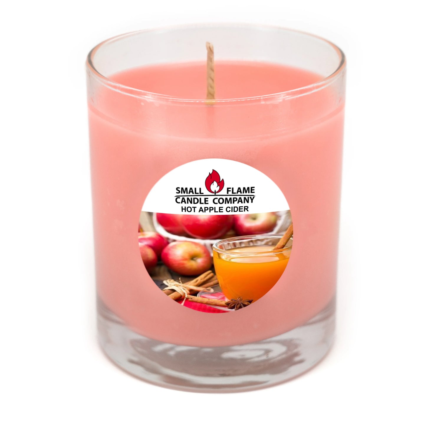 Pink soy candle in glass jar with hot apple cider and apple imagery on label