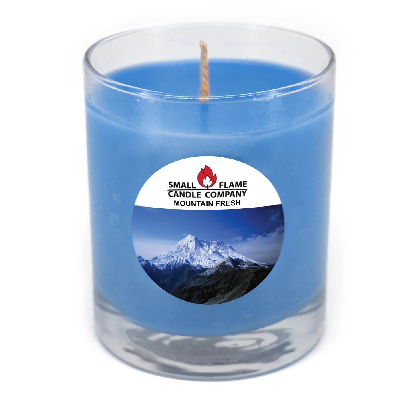 Blue coconut-soy candle in glass jar with mountain label, eco-friendly home fragrance