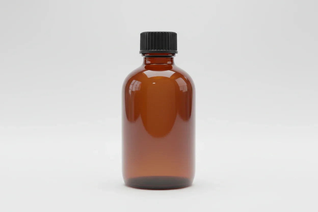 A small amber glass bottle with a black screw cap, standing upright on a plain white background. The bottle is empty and has no label or markings.