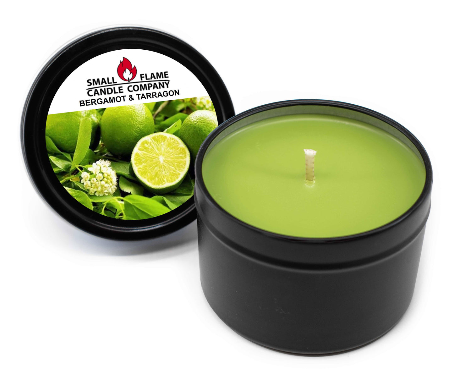 A hand-poured green Bergamot and Tarragon Candle in a black tin, with the lid showing limes and herbs beside it. The label reads Small Flame Candle Company, Bergamot & Tarragon.