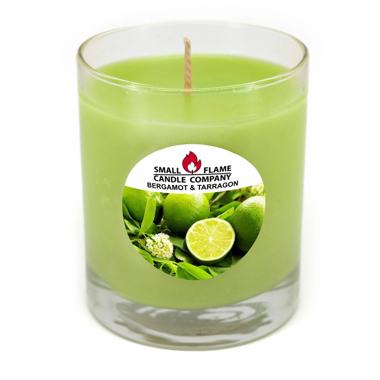 The Bergamot and Tarragon Candles and Melts feature a green coconut soy wax candle in a clear glass jar with a lime-and-leaves label. Hand-poured with a single centered wick, it’s from Small Flame Candle Company.