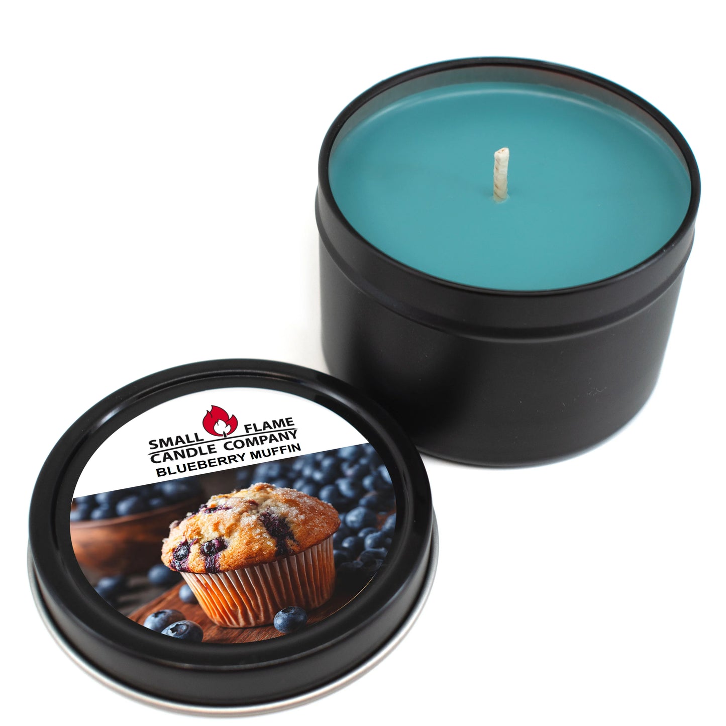 A blue Blueberry Muffin Candles and Melts candle in a black tin with the lid off. The label features a blueberry muffin and blueberries, reading “Small Flame Candle Company Blueberry Muffin.” Made with coconut soy wax and natural fragrance oils.