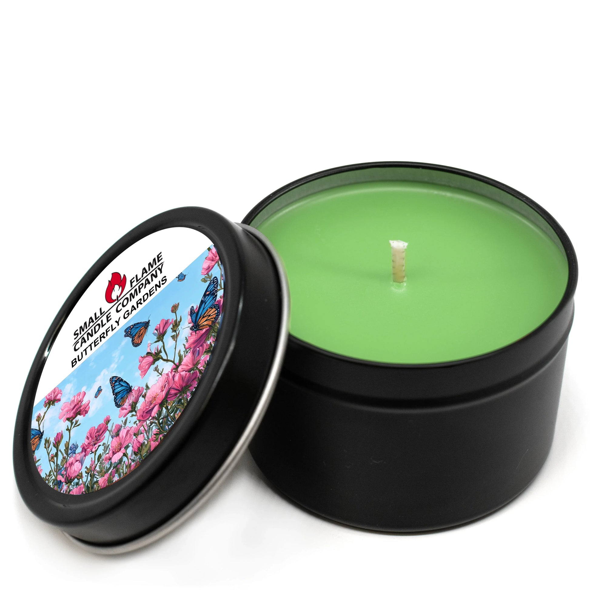 Green coconut-soy wax candle in black tin, Butterfly Garden floral label on lid