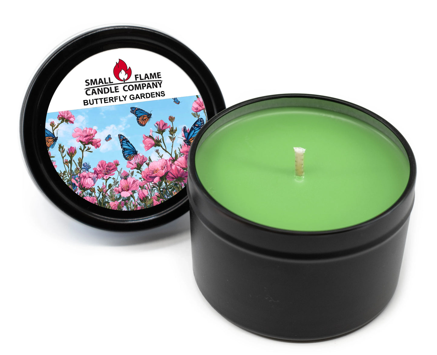 Green coconut-soy candle in black tin, butterfly gardens label with flowers and butterflies.