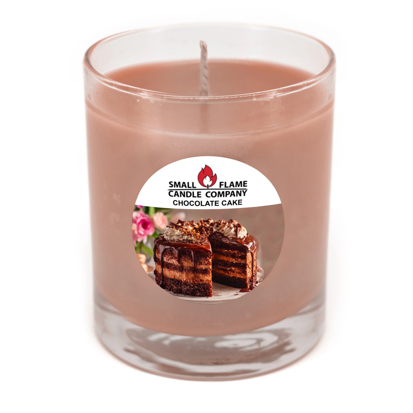 A Chocolate Cake Candle from Small Flame Candle Company, made with coconut soy wax and natural fragrance oils, in a clear glass jar featuring a chocolate cake slice with flowers.