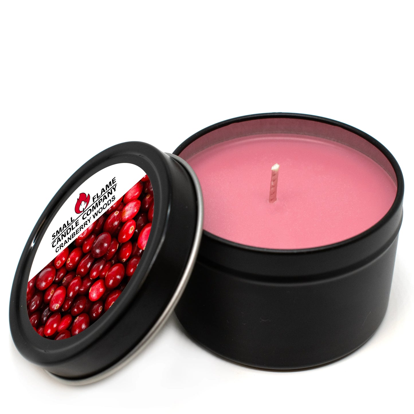 Pink cranberry woods scented candle in black tin with cranberry label