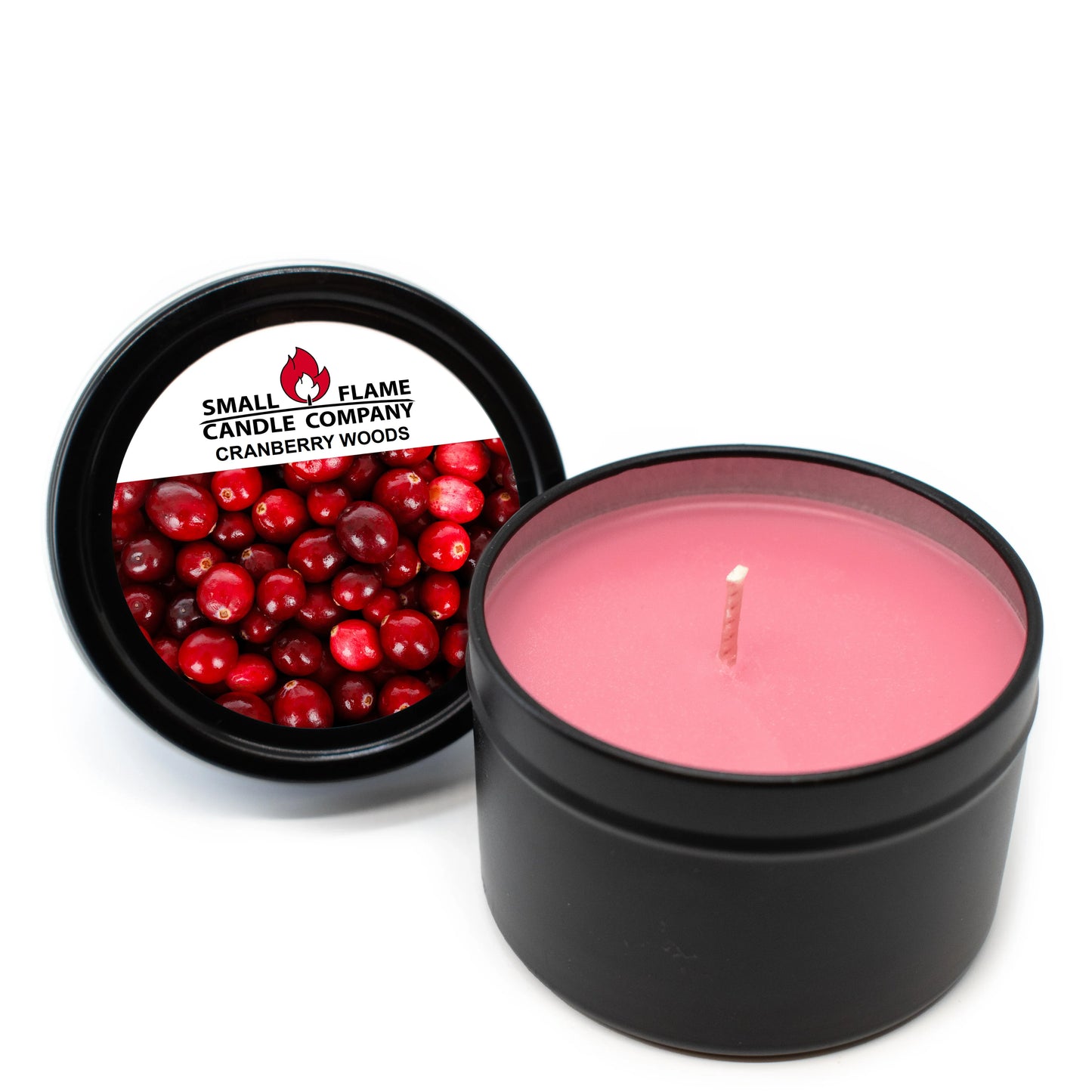 Pink cranberry woods coconut-soy candle in black tin with label and fresh cranberries