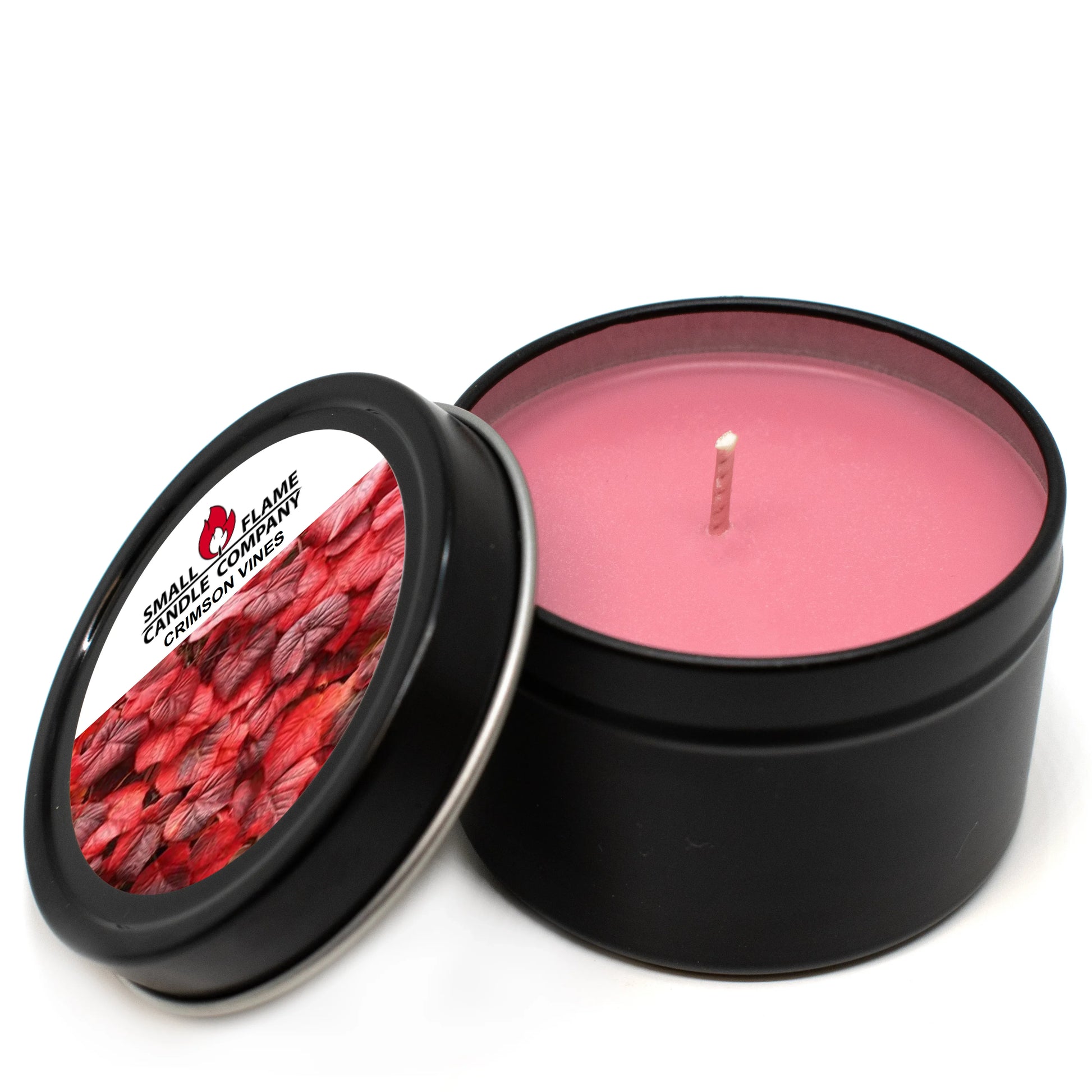 Pink coconut-soy wax candle in black tin with Crimson Vines label and open lid