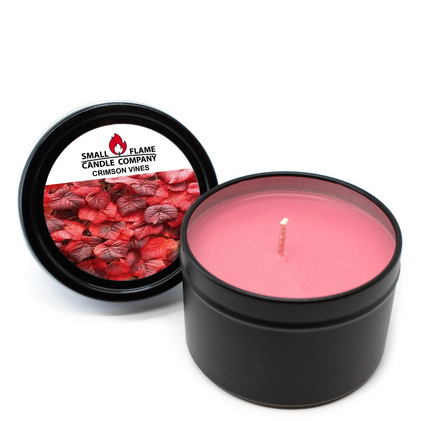 Crimson Vines pink coconut-soy candle in black tin with lid featuring red vine leaves.