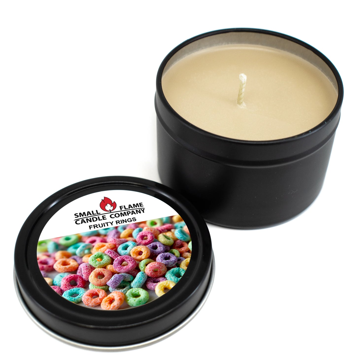 A black tin Fruity Rings Candles and Melts with its lid off. The lid shows colorful cereal rings, and the label reads Small Flame Candle Company Fruity Rings. It’s cream-colored, single-wicked, made from coconut soy wax and natural fragrance oils.