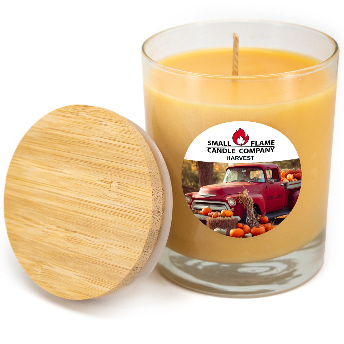 Harvest-scented coconut soy candle in glass jar with bamboo lid, fall-themed label