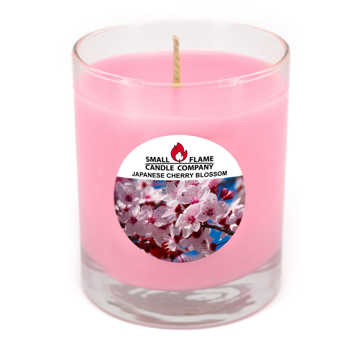 Pink Japanese cherry blossom scented candle in clear glass jar with floral label