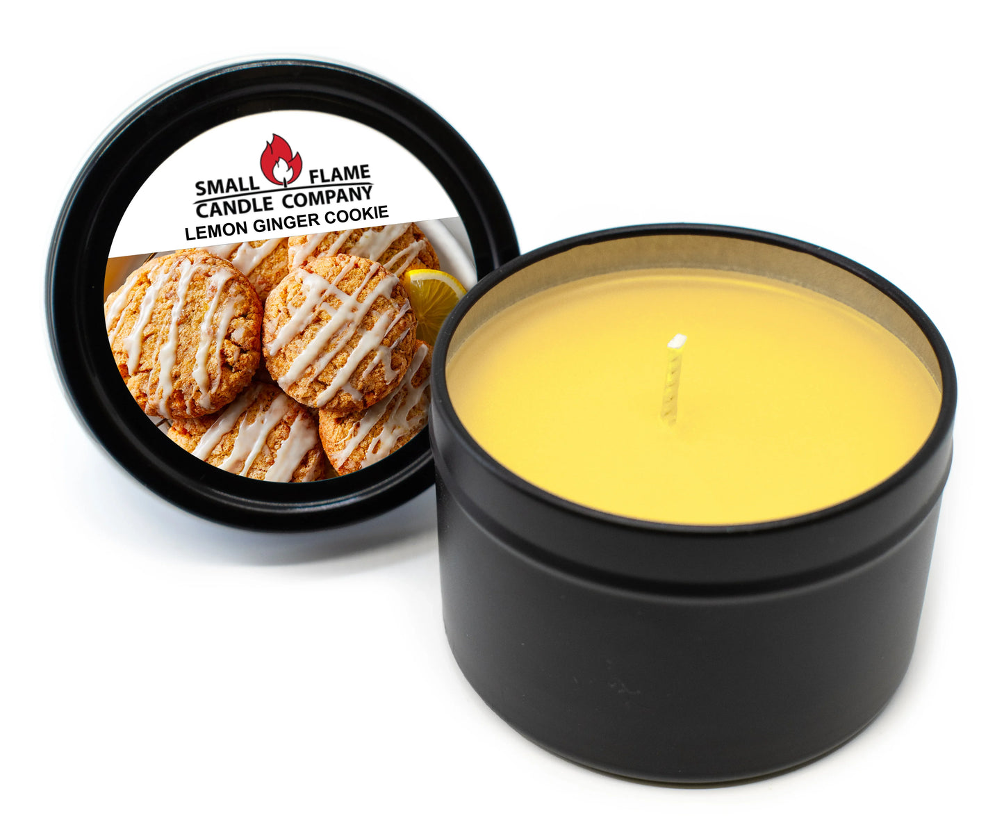 Lemon ginger cookie scented yellow candle in black tin with labeled lid on white background.