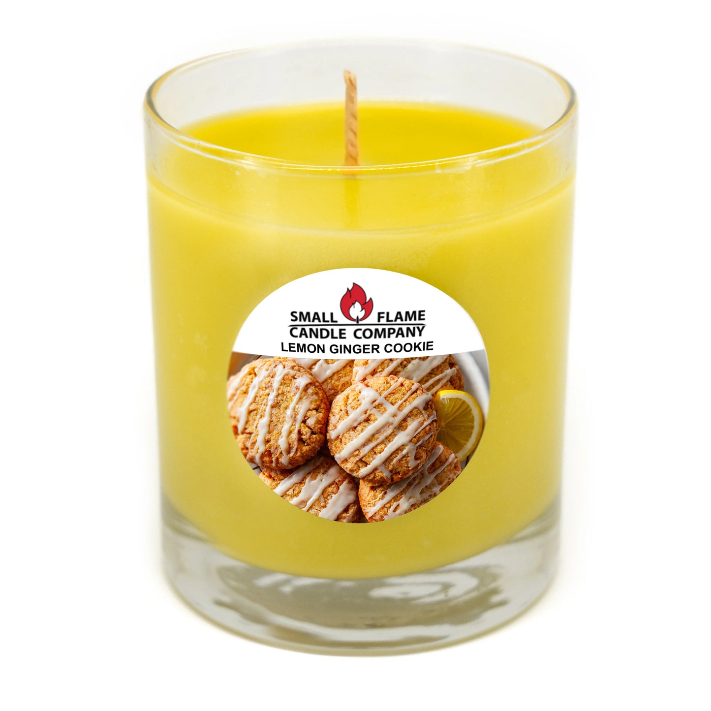 Yellow lemon ginger cookie scented candle in glass jar with single wick