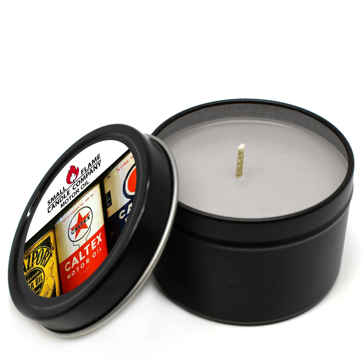 Black tin coconut-soy candle with vintage motor oil label, eco-friendly home fragrance