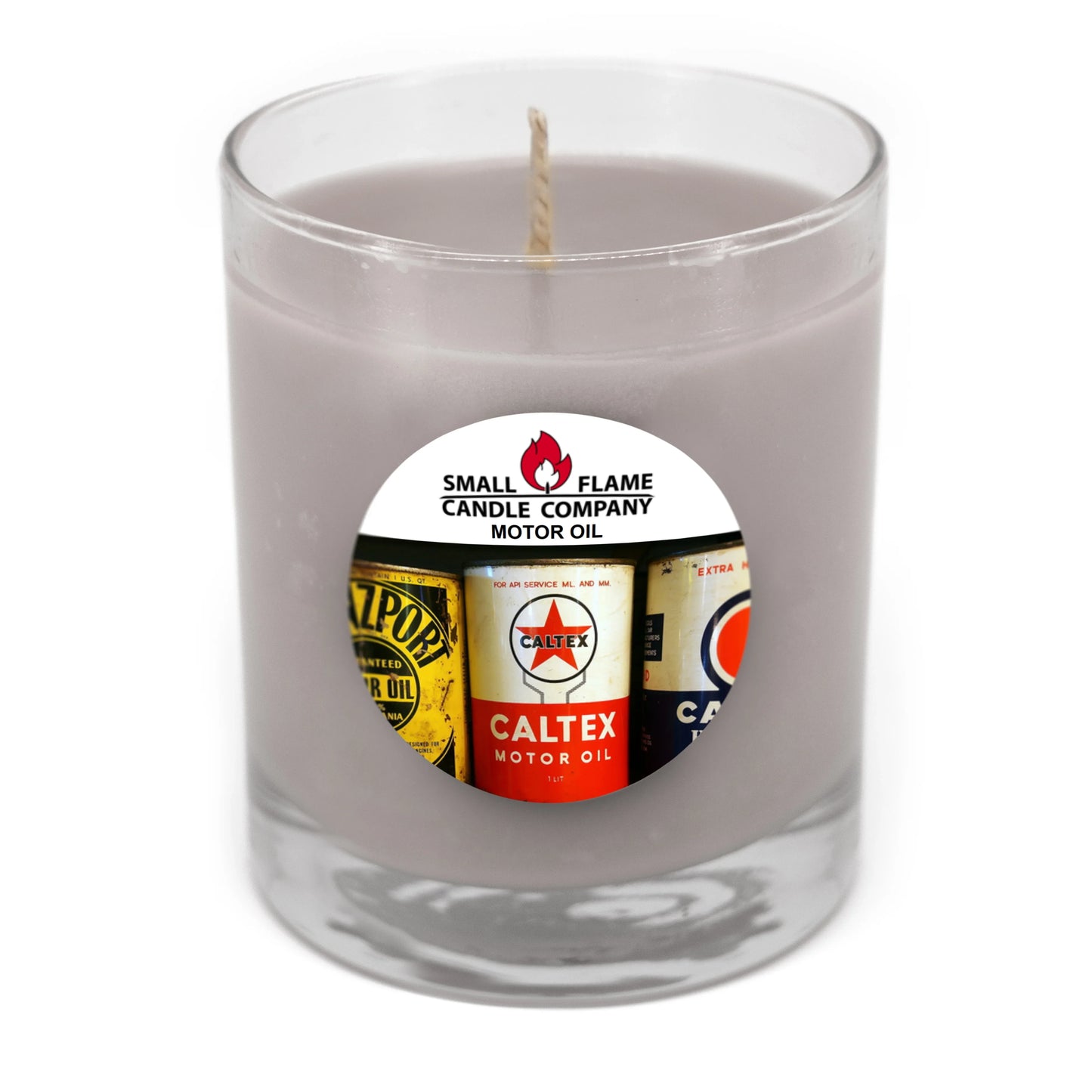 Glass jar candle with grey wax and a Motor Oil vintage label sticker on the front