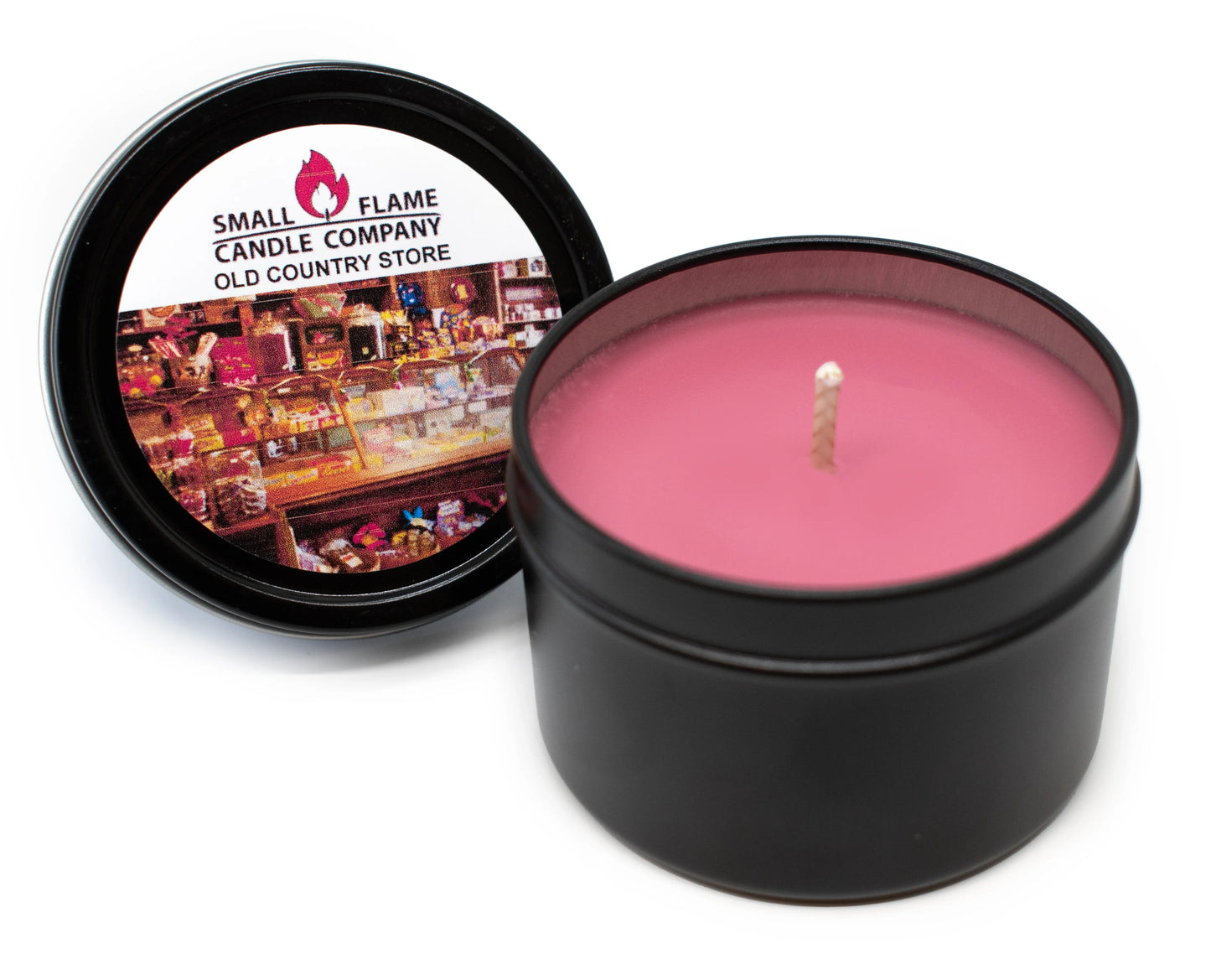 Pink coconut-soy wax candle in black tin with Old Country Store label, lid open