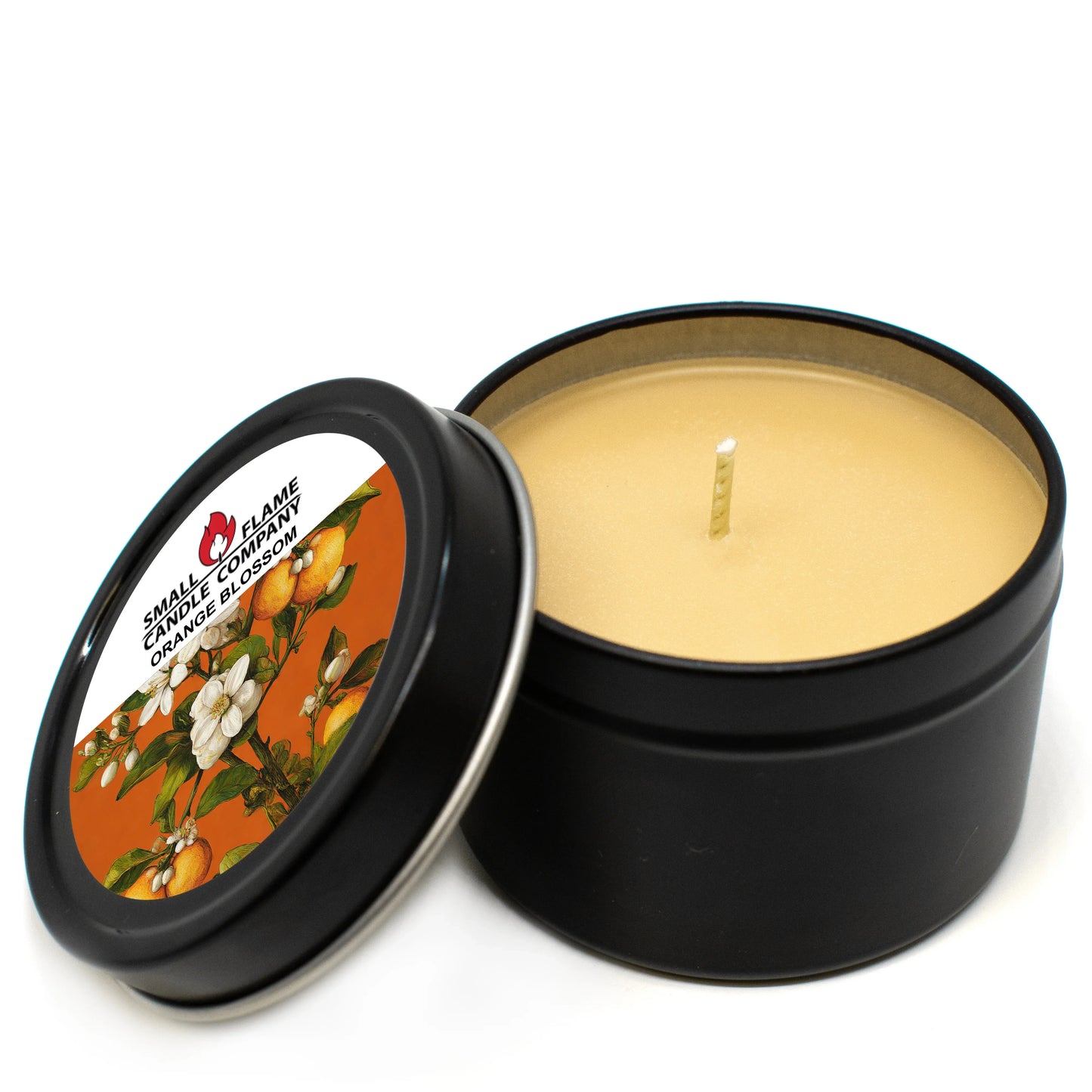 Orange Blossom coconut-soy candle in black tin with floral and citrus label