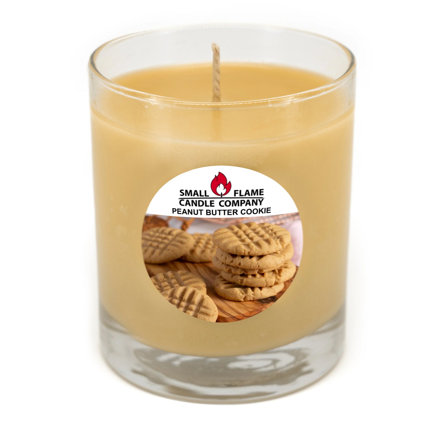 Peanut butter cookie scented coconut-soy candle in a glass jar with cookie label