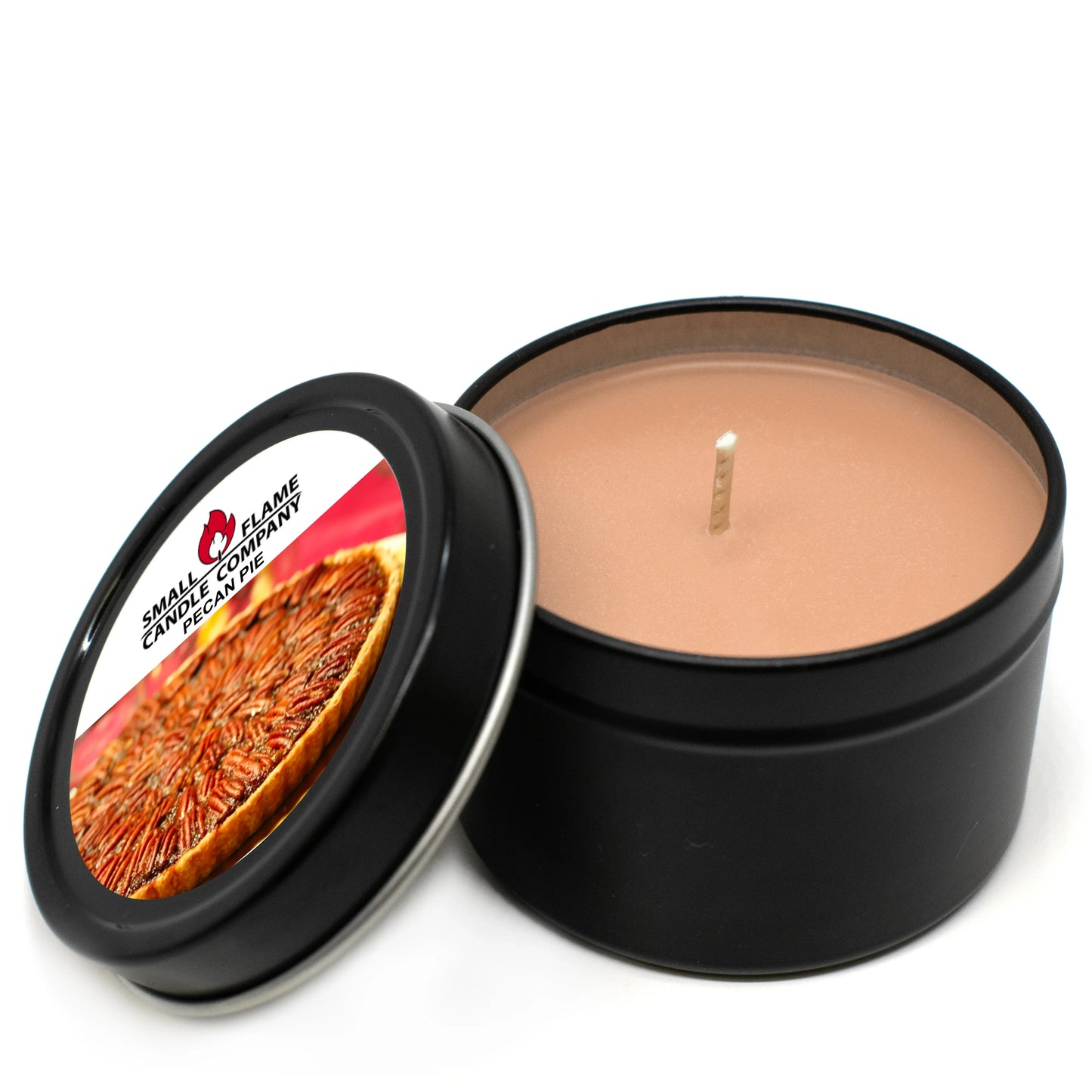 Pecan pie scented coconut-soy candle in a black tin with lid and pecan pie label
