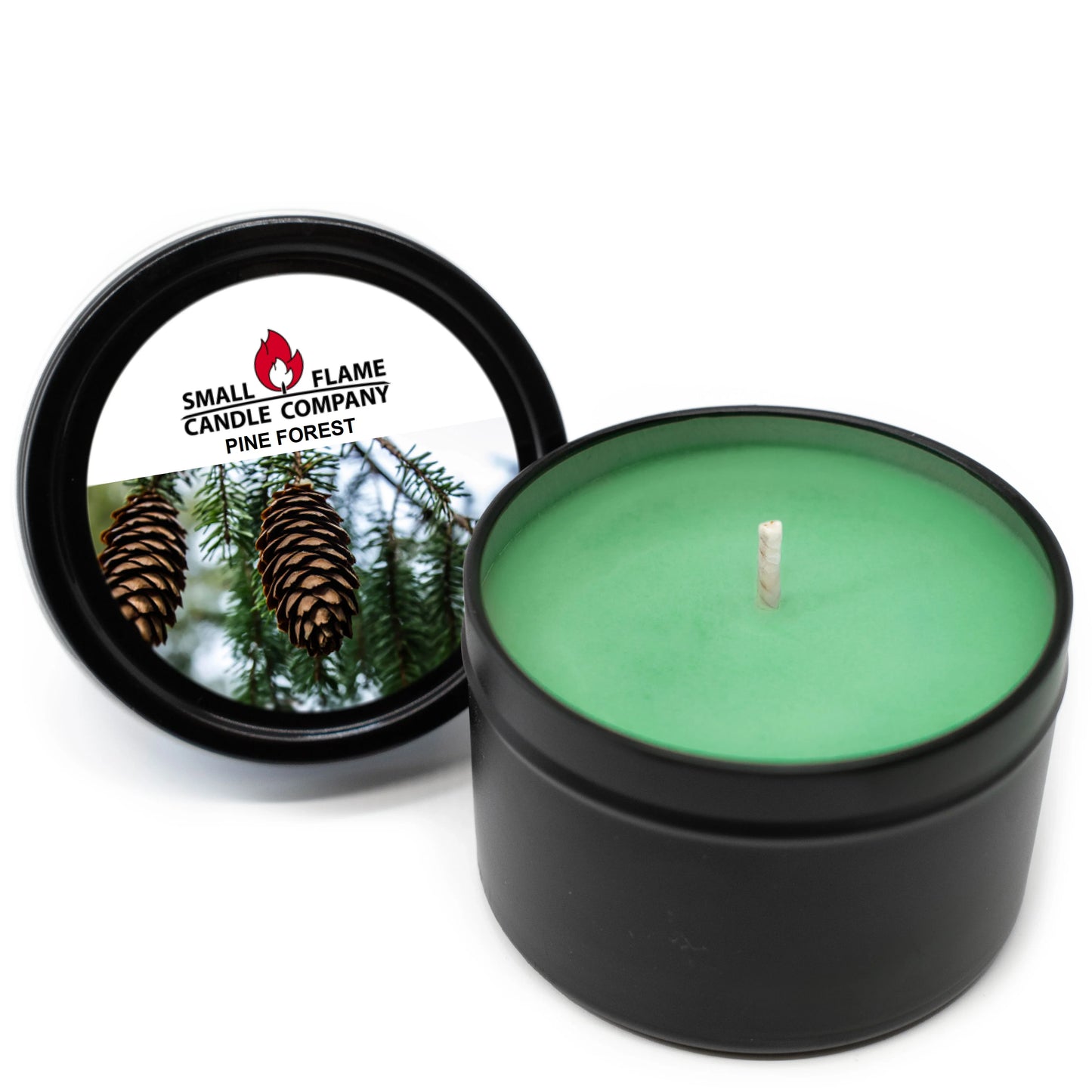 Green soy candle in black tin labeled Pine Forest with pine cones on the lid