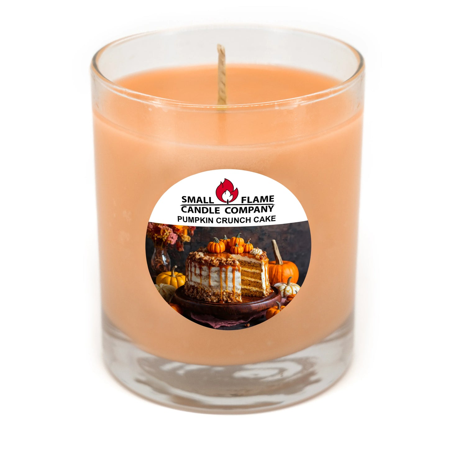 Pumpkin Crunch Cake scented soy candle in clear glass jar with fall-themed label.