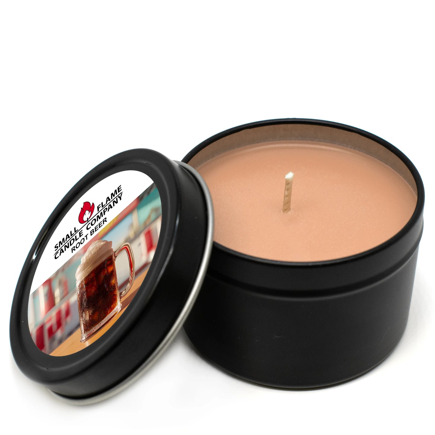 Root beer scented coconut-soy candle in black tin with open lid and single wick
