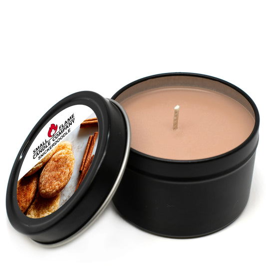 Snickerdoodle scented coconut-soy candle in black tin with cookies and cinnamon label