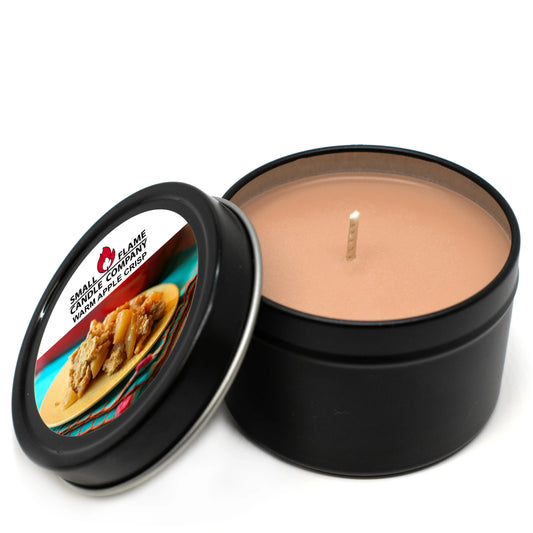 Warm apple crisp scented coconut-soy candle in black tin with open lid